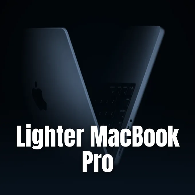 A sleek dark gray MacBook Pro laptop standing partially open against a dark minimalist studio background.