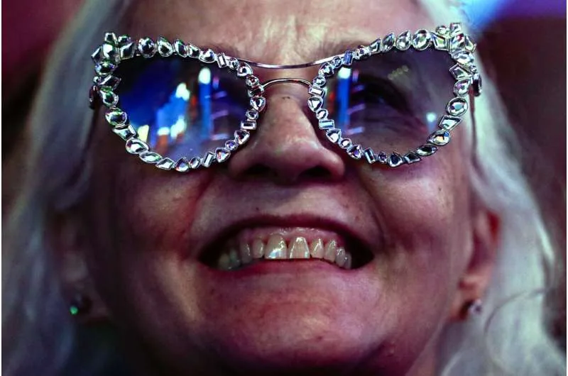 A music fan smiles during a concert performance in Rio de Janeiro.