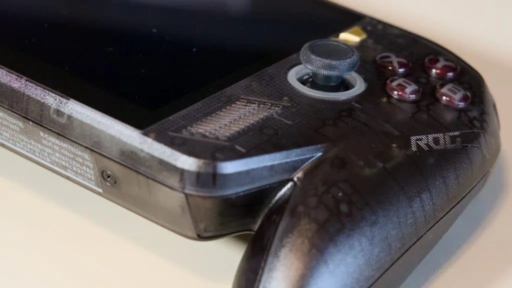 Right profile of the Asus gaming handheld showing side grip and bumper.