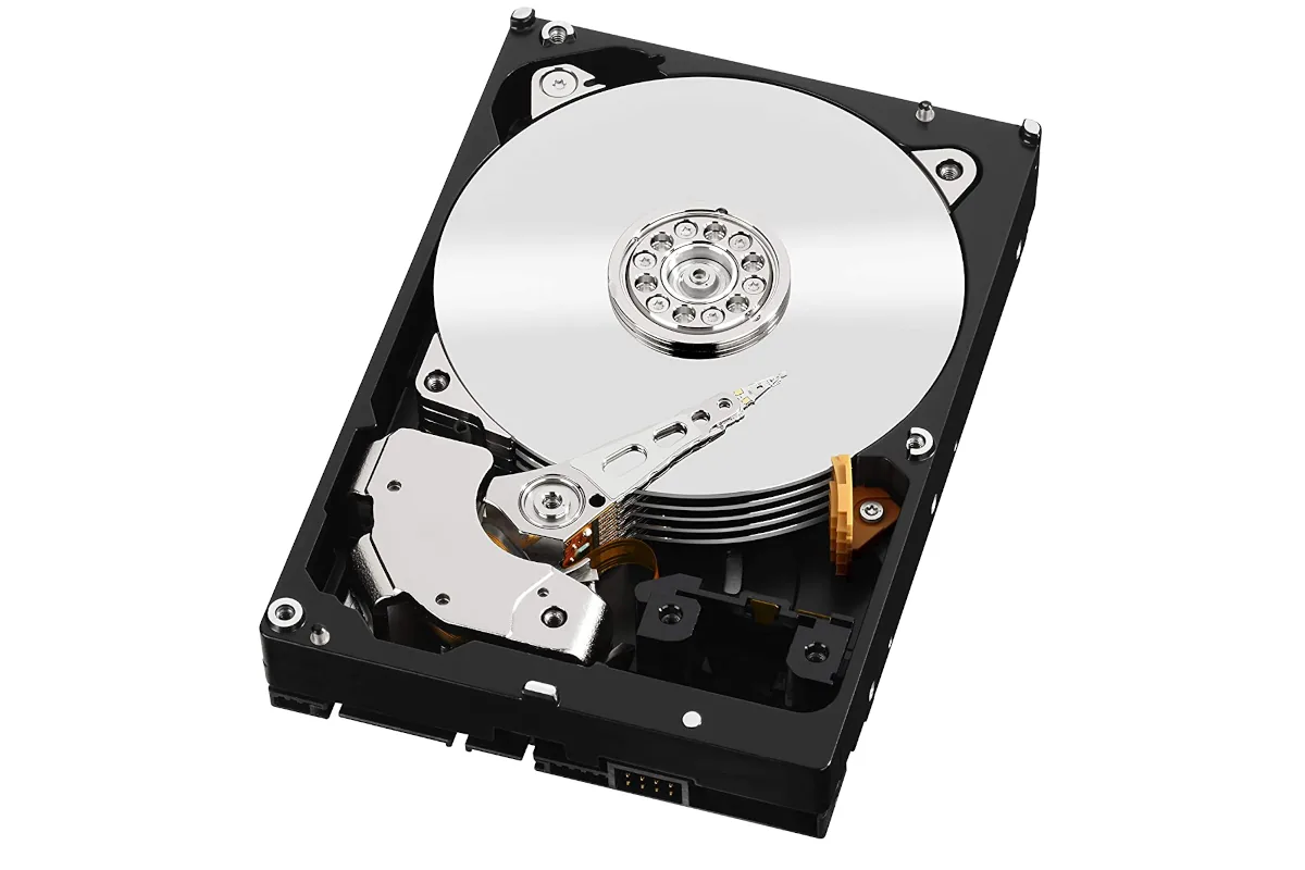 A traditional hard disk drive with spinning platters and read heads exposed.