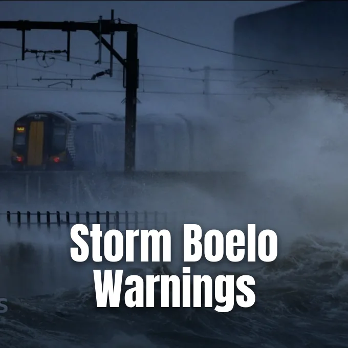 A passenger train travels along coastal tracks during rough seas and stormy weather.