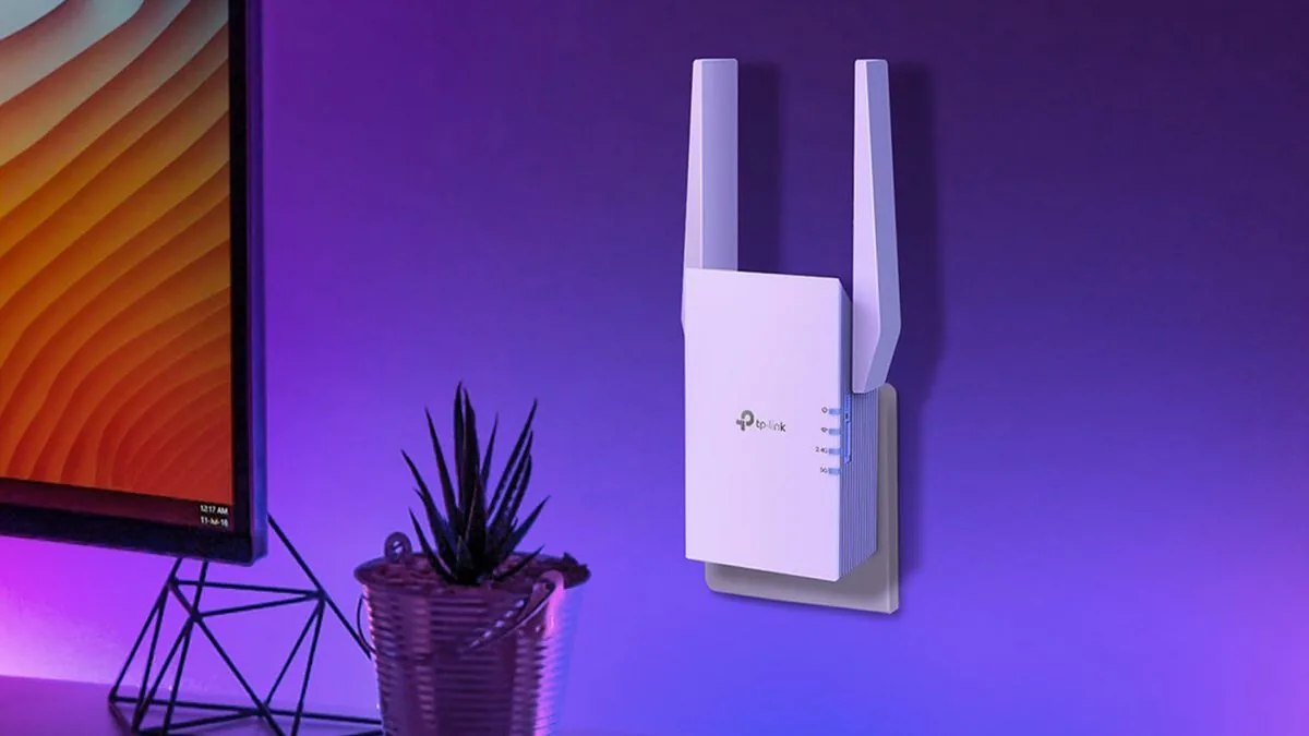 TP-Link RE705X range extender plugged into a wall outlet