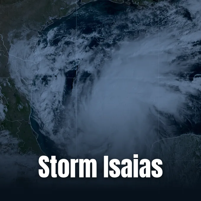 Satellite imagery showing a large tropical storm system swirling over the Gulf of Mexico.