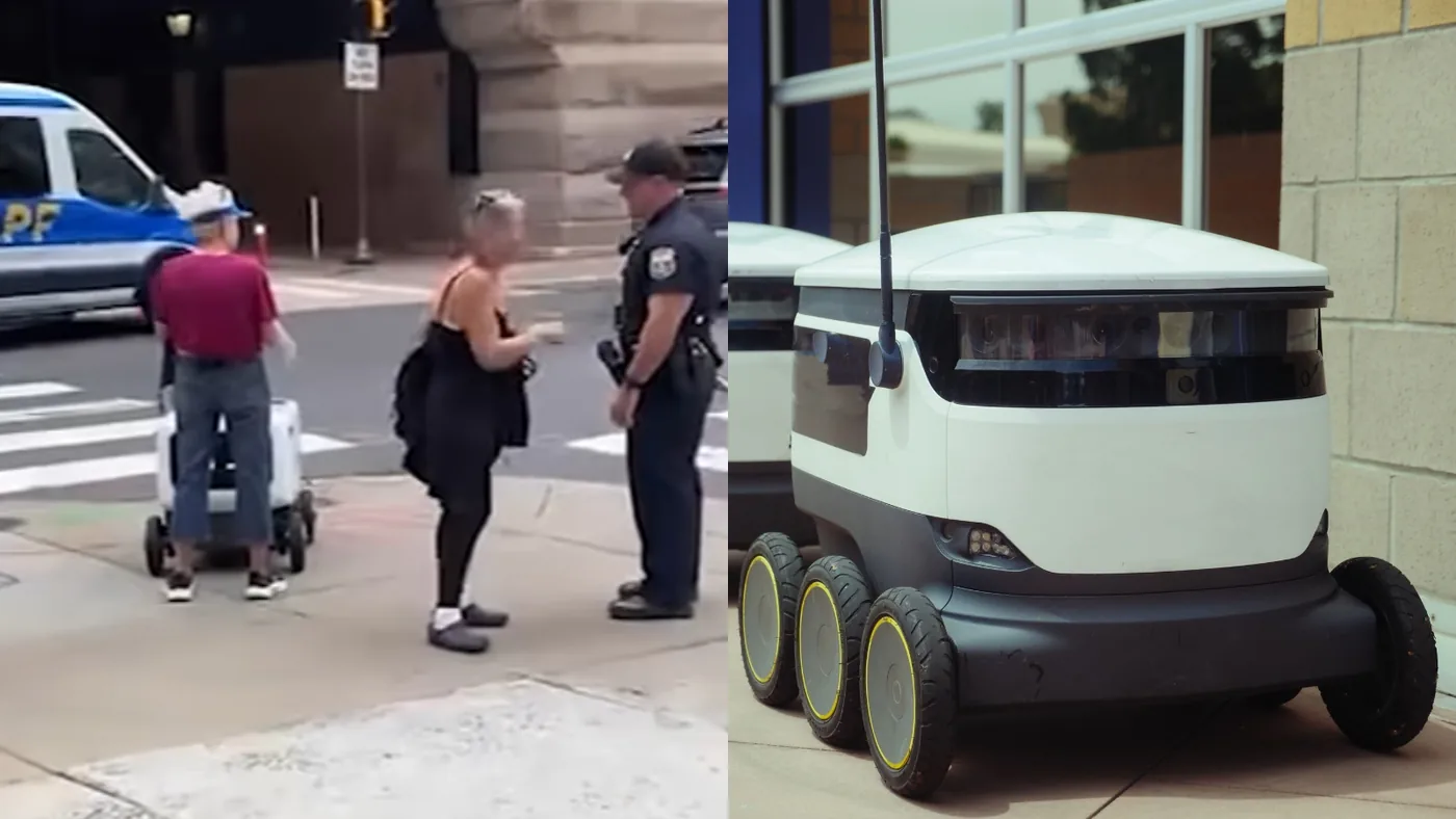 A woman standing on a city sidewalk during an interaction involving an autonomous delivery device