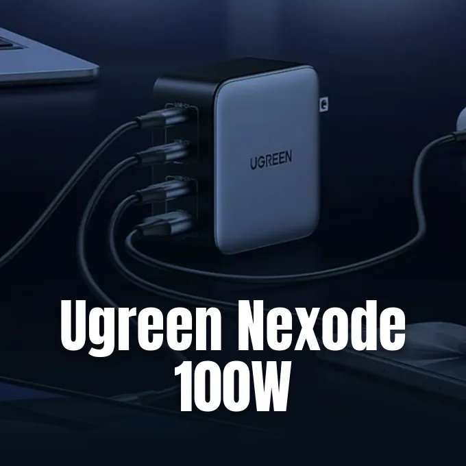 A four-port Ugreen GaN wall charger sitting on a desk with multiple cables plugged in.