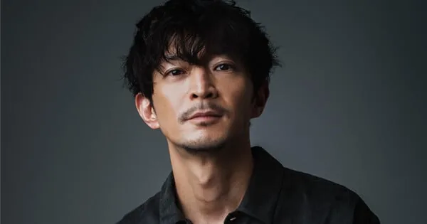 Voice actor Kenjiro Tsuda photographed during voice production coverage.