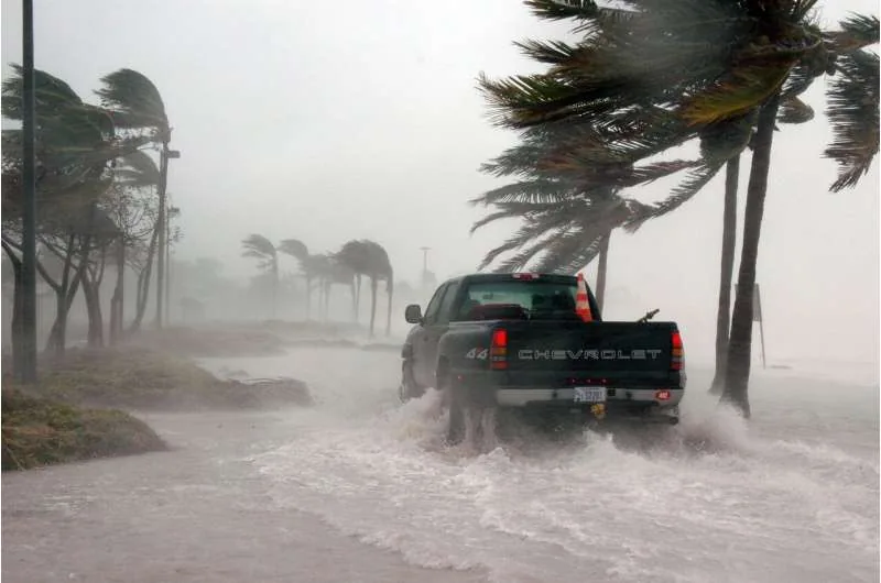 Coastal residential neighborhood showing damage from a major tropical storm.