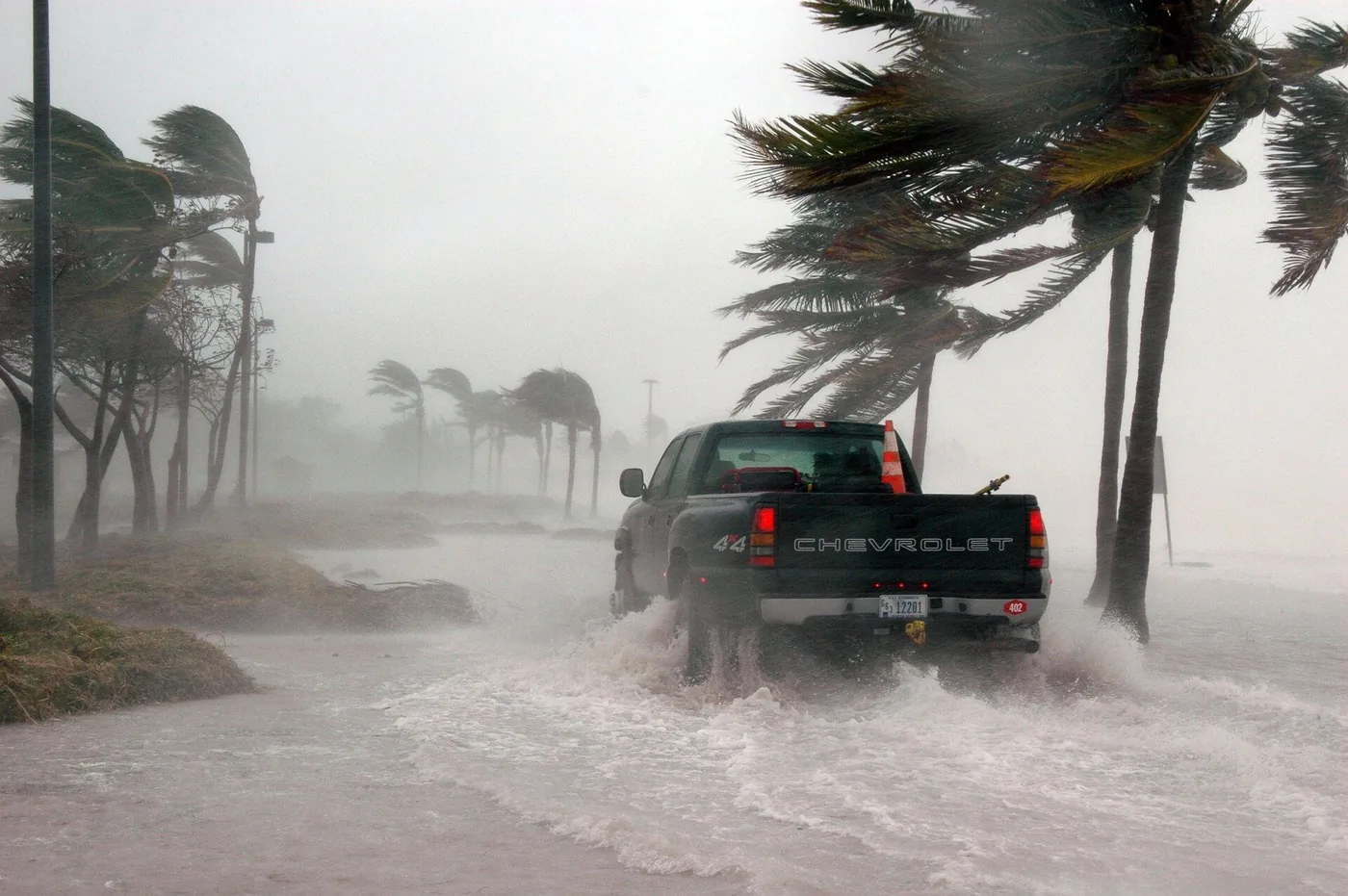 A flooded street and damaged homes after a catastrophic storm in the Gulf Coast.